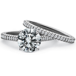DescriptionThis image shows the setting with a round .75ct center diamond. The setting can be ordered to accommodate any shape/size diamond listed in the setting details section below. The matching wedding band is sold separately. 