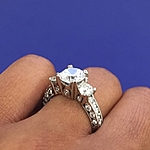 This image shows the setting with a 1.50ct princess cut center diamond. 