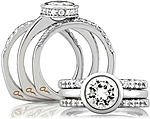 This image shows the setting with a 1.00ct round brilliant cut center diamond. The setting can be ordered to accommodate any shape/size diamond listed in the setting details section below.	 Shown with the matching wedding band; sold separately.