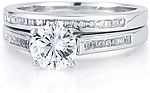 This image shows the setting with a 1.00ct round brilliant cut center diamond and the matching wedding band; sold separately.