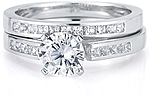 This image shows the setting with a 1.00ct round brilliant cut center diamond and the matching wedding band; sold separately.