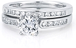 This image shows the setting with a 1.00ct round brilliant cut center diamond and the matching wedding band; sold separately.