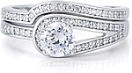 This image shows the setting with a 1.00ct round brilliant cut center diamond and the matching wedding band; sold separately.