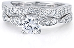 This image shows the setting with a 1.00ct round brilliant cut center diamond and the matching wedding band; sold separately.