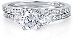 This image shows the setting with a 1.00ct round brilliant cut center diamond and the matching wedding band; sold separately.