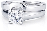 This image shows the setting with a 1.00ct round brilliant cut center diamond with the matching wedding band;Sold separately.