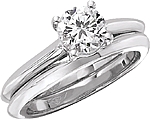 This image shows the setting with a 1.00ct round brilliant cut center diamond. The setting can be ordered to accommodate any shape/size diamond listed in the setting details section below. The matching wedding band is sold separately.