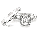 This image shows the setting with its matching wedding band, style # HD WBPL which is sold separately.  The center cushion cut diamond is also sold seperately.