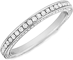 This image shows the wedding band with .58ct round brilliant cut pave set diamonds by Henri Daussi.