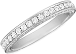 This image shows the wedding band with .80ct round brilliant cut pave set diamonds by Henri Daussi.