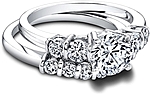 This image shows the setting with a 1.25ct round brilliant cut center diamond. The setting can be ordered to accommodate any shape/size diamond listed in the setting details section below. Shown with the matching wedding band; Sold separately.