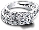 This image shows the setting with a 1.00ct round brilliant cut center diamond. The setting can be ordered to accommodate any shape/size diamond listed in the setting details section below. Shown with the matching wedding band; Sold separately.