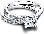 This image shows the setting with a 1.00ct cushion cut center diamond. The setting can be ordered to accommodate any shape/size diamond listed in the setting details section below. Shown with the matching wedding band; Sold separately.
