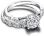This image shows the setting with a 1.00ct round brilliant cut center diamond. The setting can be ordered to accommodate any shape/size diamond listed in the setting details section below. Shown with the matching wedding band; Sold separately.
