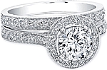 This image shows the setting with a 1.25ct round brilliant cut center diamond. The setting can be ordered to accomodate any shape/size diamond listed in the setting details section below. 