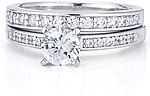 This image shows the setting with a 1.00ct round brilliant cut center diamond and the matching wedding band; sold separately.