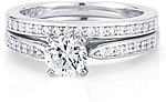 This image shows the setting with a 1.00ct round brilliant cut center diamond and the matching wedding band; sold separately.