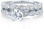 This image shows the setting with a 1.00ct round brilliant cut center diamond and the matching wedding band; sold separately.