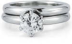 This image shows the setting with a 1.00ct round brilliant cut center diamond with the matching wedding band;Sold separately.