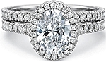 This image shows the setting with a 1.50ct oval cut center diamond. The setting can be ordered to accommodate any shape/size diamond listed in the setting details section below. Shown with the matching wedding band; Sold separately.