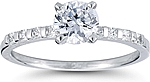 This image shows the setting with a 1.00ct round brilliant cut center diamond. The setting can be ordered to accommodate any shape/size diamond listed in the setting details section below.