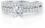 This image shows the setting with a 1.00ct round brilliant cut center diamond and the matching wedding band; sold separately.