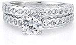 This image shows the setting with a 1.00ct round brilliant cut center diamond and the matching wedding band; sold separately.