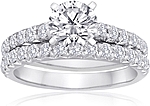 This image shows the setting with a 1.00ct round brilliant cut center diamond. The setting can be ordered to accommodate any shape/size diamond listed in the setting details section below. Wedding band sold separately.