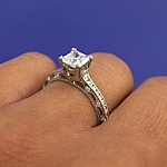This image shows the ring with a .75ct princess cut center diamond.