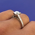 This image shows the setting with a 1.00ct round brilliant cut center diamond.