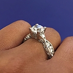 This image shows the setting with a 1.25ct round brilliant cut center diamond. The setting can be ordered to accommodate any shape/size diamond listed in the setting details section below. The diamonds are shown 3/4 around.