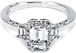 This image shows the setting with a 1.00ct emerald cut center diamond. The setting can be ordered to accommodate any shape/size diamond listed in the setting details section below.