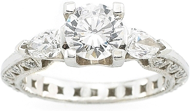 This image shows the setting with a 1.00ct round brilliant cut center diamond. The setting can be ordered to accomodate any shape/size diamond listed in the setting details section below.