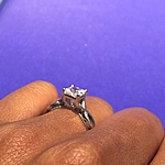 This image shows the setting with a .85ct princess cut center diamond.