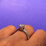 This image shows the setting with a .80ct round cut center diamond. 