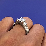 This image shows the setting with a 1.00ct round brilliant cut center diamond. 