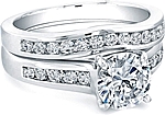 This image shows the setting with a 1.00ct round brilliant cut center diamond. The setting can be ordered to accommodate any shape/size diamond listed in the setting details section below. Pictured with matching wedding band (sold separately).