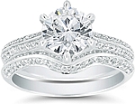 This image shows the setting with a 1.25ct round brilliant cut center diamond. The setting can be ordered to accommodate any shape/size diamond listed in the setting details section below. Shown with matching wedding band (sold separately).