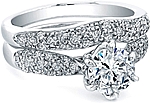 This image shows the setting with a 1.00ct round brilliant cut center diamond. The setting can be ordered to accommodate any shape/size diamond listed in the setting details section below. Pictured with matching wedding band (sold separately).