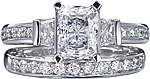This image shows the setting with a 1.25ct radiant cut center diamond. The setting can be ordered to accommodate any shape/size diamond listed in the setting details section below. The matching wedding band is sold separately.