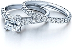 This image shows the setting with a 1.25ct round brilliant cut center diamond. The setting can be ordered to accommodate any shape/size diamond listed in the setting details section below. The matching wedding band is sold separately. 