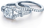 This image shows the setting with a 1.25ct princess cut center diamond. The setting can be ordered to accommodate any shape/size diamond listed in the setting details section below. The matching wedding band is sold separately.